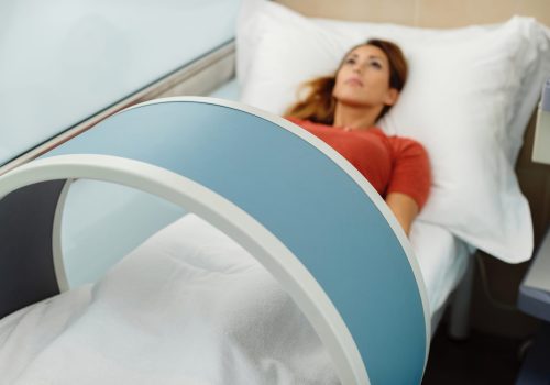Close-up of woman having magnetotherapy at medical clinic.